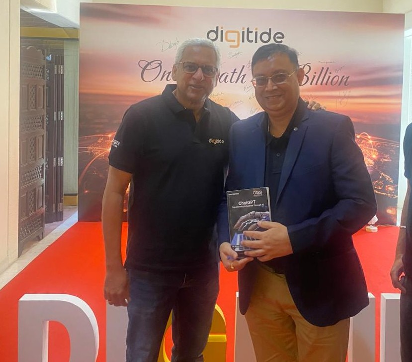 Ajit Issac and Rinoo Rajesh posing with the signed copy of ChatGPT – Transforming Industries through Generative AI.